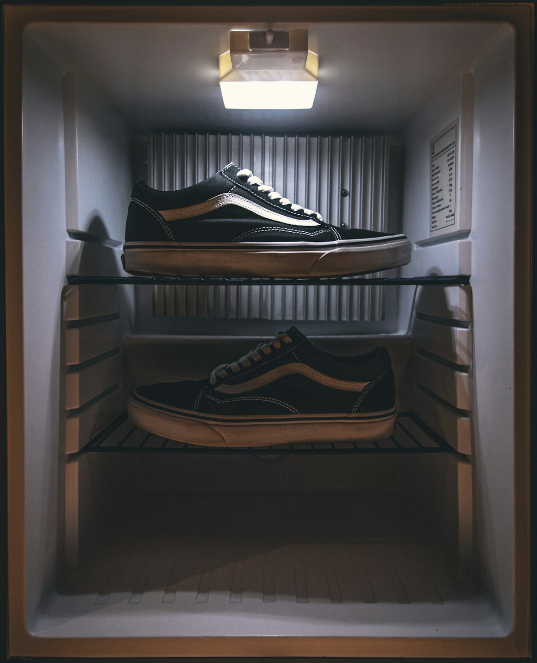pair-of-black-vans-low-top-sneakers-on-rack-fkwovemt8fo